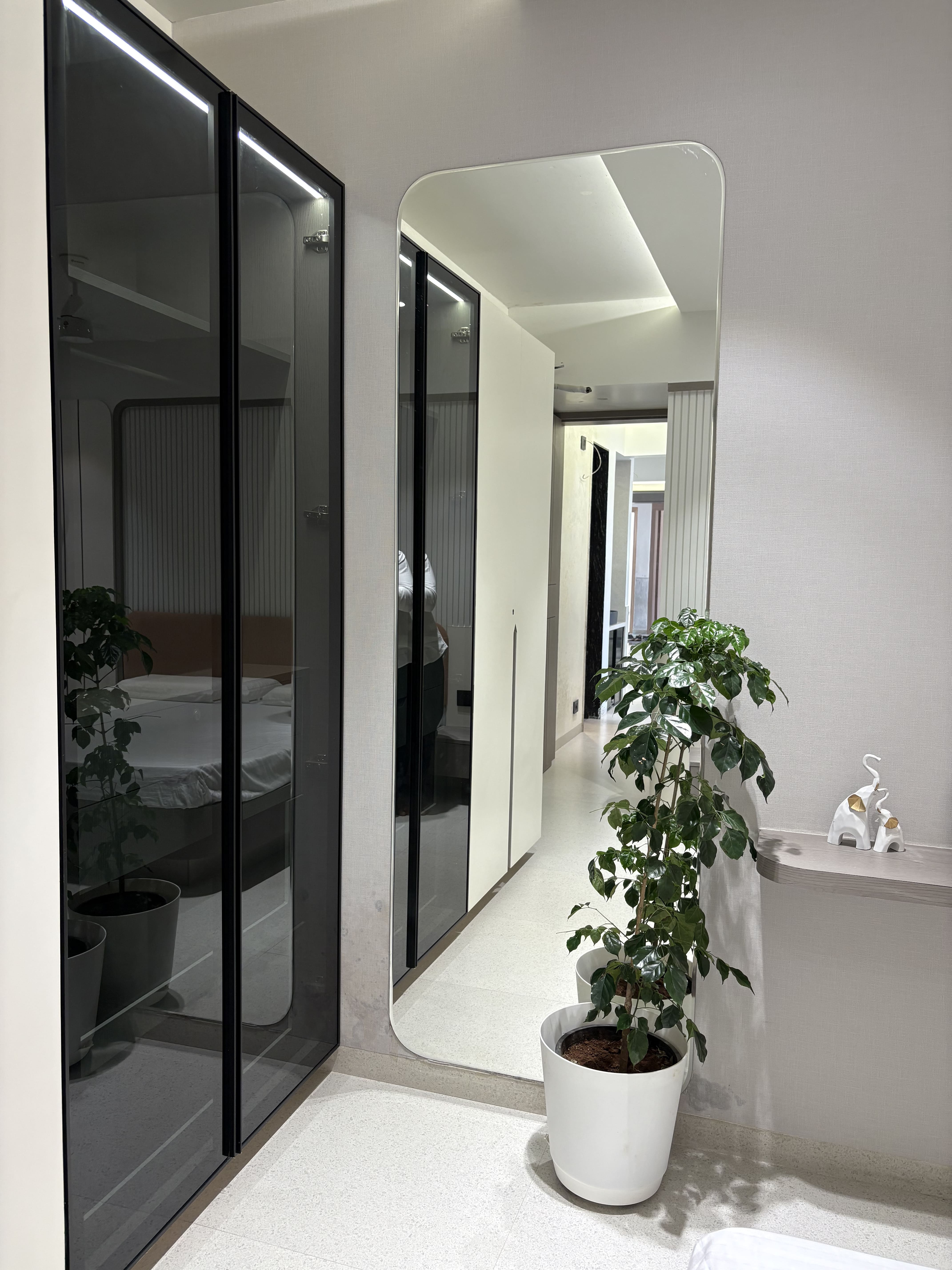 Elegant bedroom with integrated wardrobe design by Jupiter Interiors